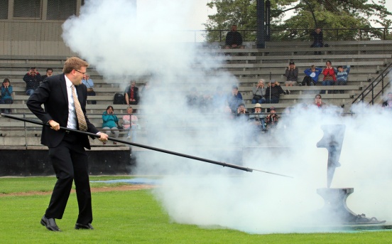 New Westminster Mayor Jonathan Coté flinches as he gets his turn to fire the anvil salute. Photo by Mario Bartel