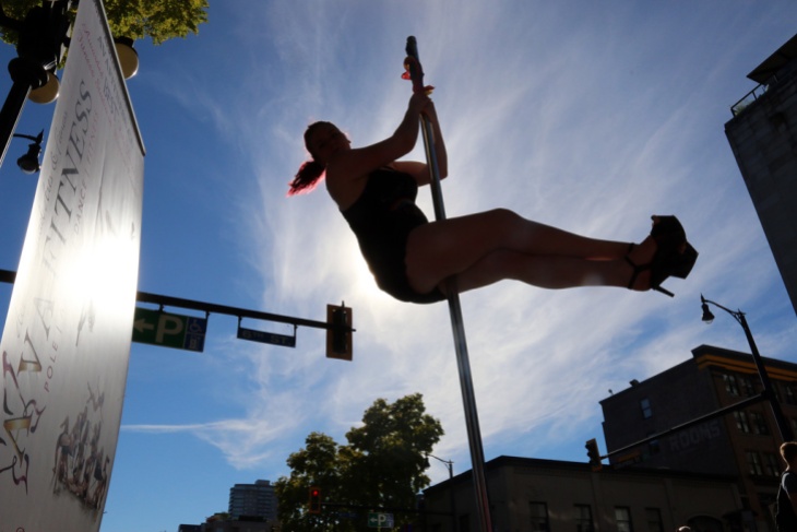 PHOTO BY MARIO BARTEL A pole dancer from AVA Fitness gets some height at Saturday's Pride street party.