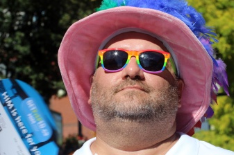 PHOTO BY MARIO BARTEL Dale Guthrie tries to stay cool in the hot sun at Saturday's Pride street party.