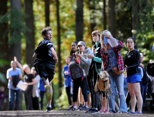 Fall light is beautiful. The kid looking back at his competitors is just a happy accident because I orinally lined up this photo to take advantage of the backlight through the trees and spectators along the cross-country course in Mundy Park.