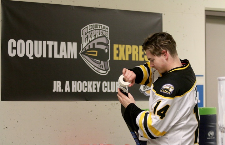 MARIO BARTEL/THE TRI-CITY NEWS Coquitlam Express forward Dallas Farrell gets his stick ready for Wednesday's game against the Langley Rivermen.