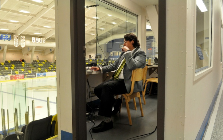 MARIO BARTEL/THE TRI-CITY NEWS Longtime Express broadcaster Eddie Gregory does some last-minute preparation in his booth at center ice. He's been with the team since it's first season.