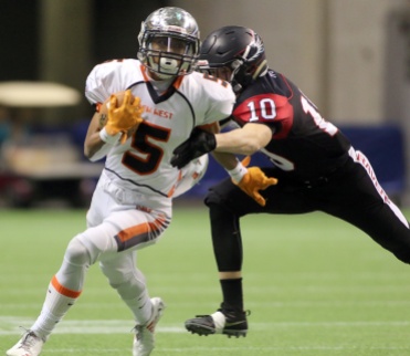 MARIO BARTEL/THE TRI-CITY NEWS New Westminster Hyacks ball carrier Broxx Comia slips the grasp of Terry Fox Ravens tackler Cade Cote in their BC Secondary Schools Football Association AAA Subway Bowl semi-final, Saturday at BC Place Stadium. New Westminster won the game, 33-0.