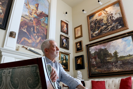 MARIO BARTEL/THE TRI-CITY NEWS Retired engineer Cosimo Geracitano has surrounded himself with paintings in his Coquitlam home by some of the world's great masters, including Da Vinci, Renoir, Van Gogh and John Constable. But he's not fabulously wealthy. He's meticulously painted the reproductions himself.