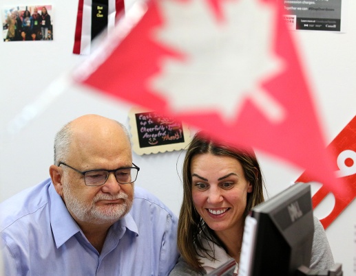 MARIO BARTEL/THE TRI-CITY NEWS The Liberal MP for Coquitlam-Port Coquitlam, Ron McKinnon, watches election night results come in with one of his campaign volunteers, Haley Hodgson. For all the buildup to covering election nights, they're usually a visual let-down. The celebration parties are usually in dark, crowded halls, restaurants or pubs with lots of hugging and handshaking. So when Liberal MP Ron McKinnon decided to spend a little more time at his nearby campaign office to monitor the incoming results, I asked if I could tag along.